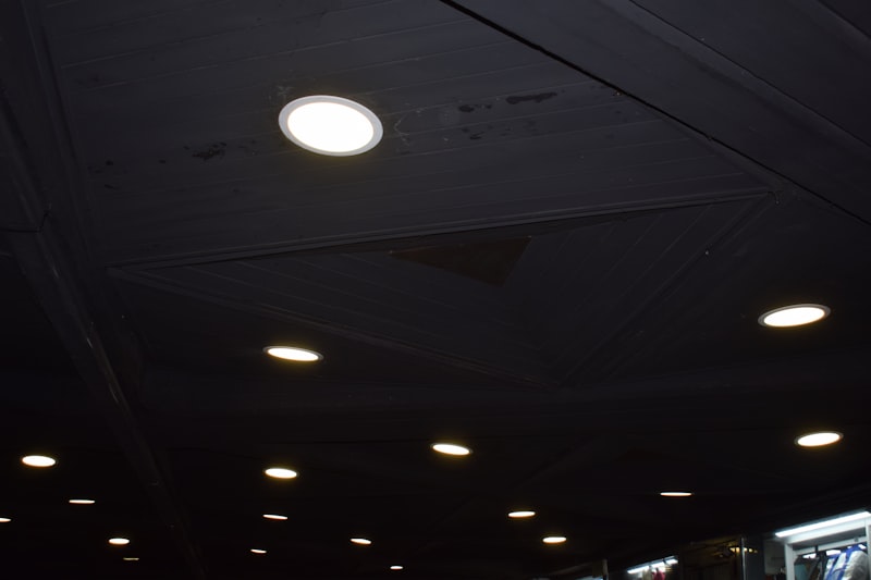 A modern room lit with recessed downlights