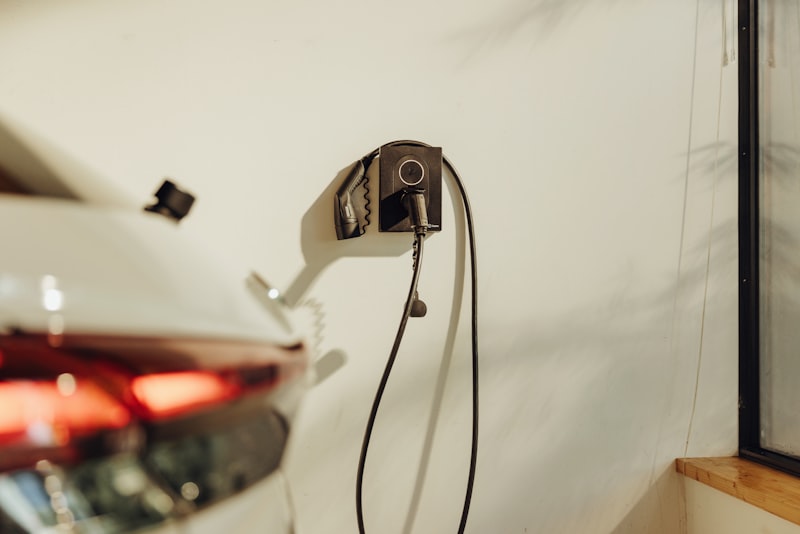 An EV charger installed by a driveway
