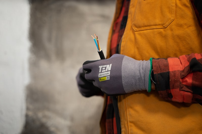 Electrician running new wiring in a wall