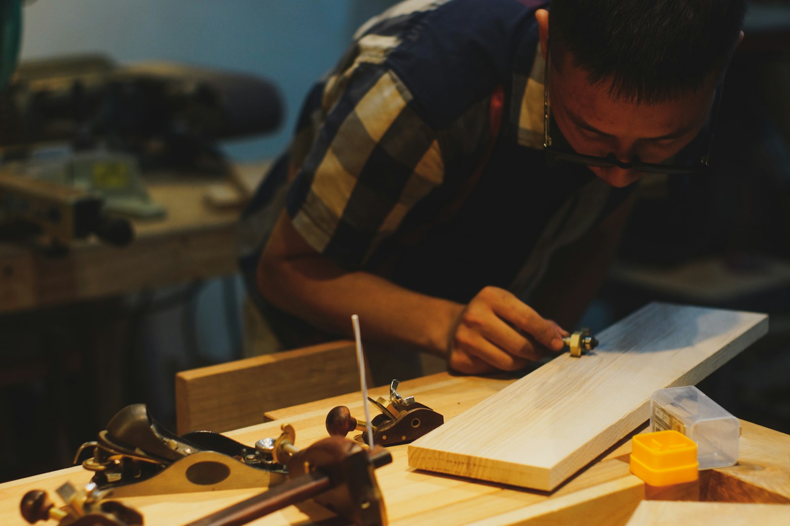 Carpenter working with timber in a workshop