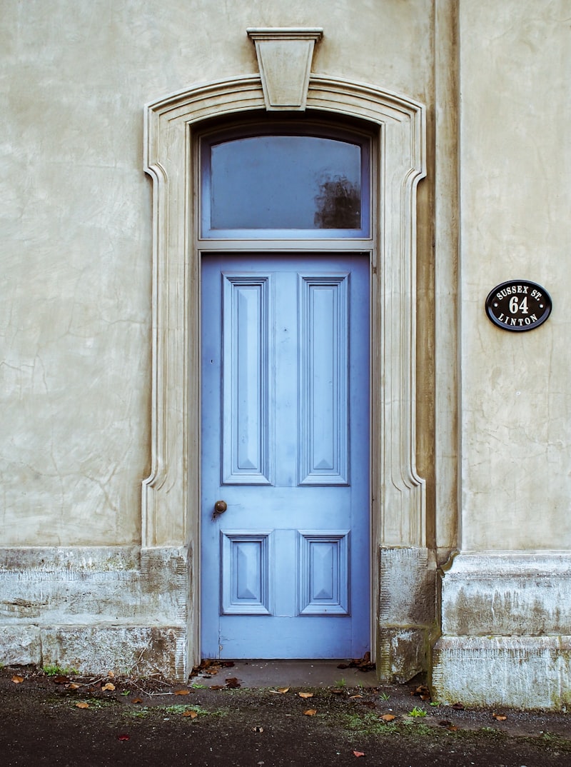 A wooden door being hung